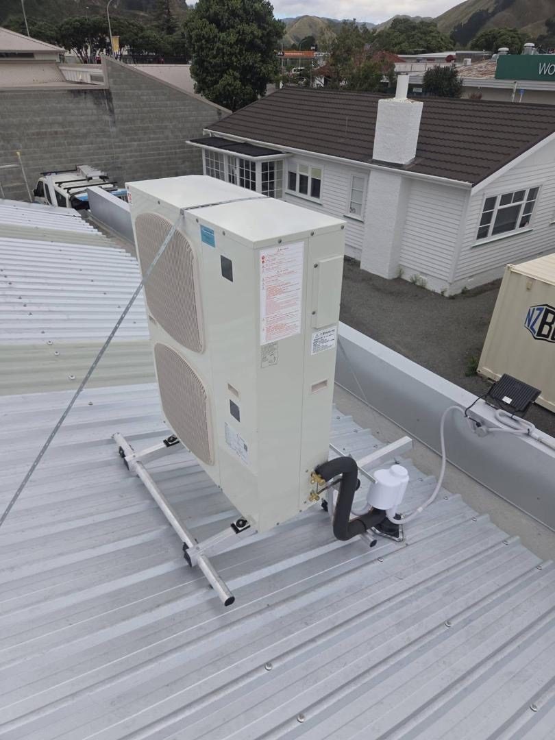 HVAC technician installing a heat pump